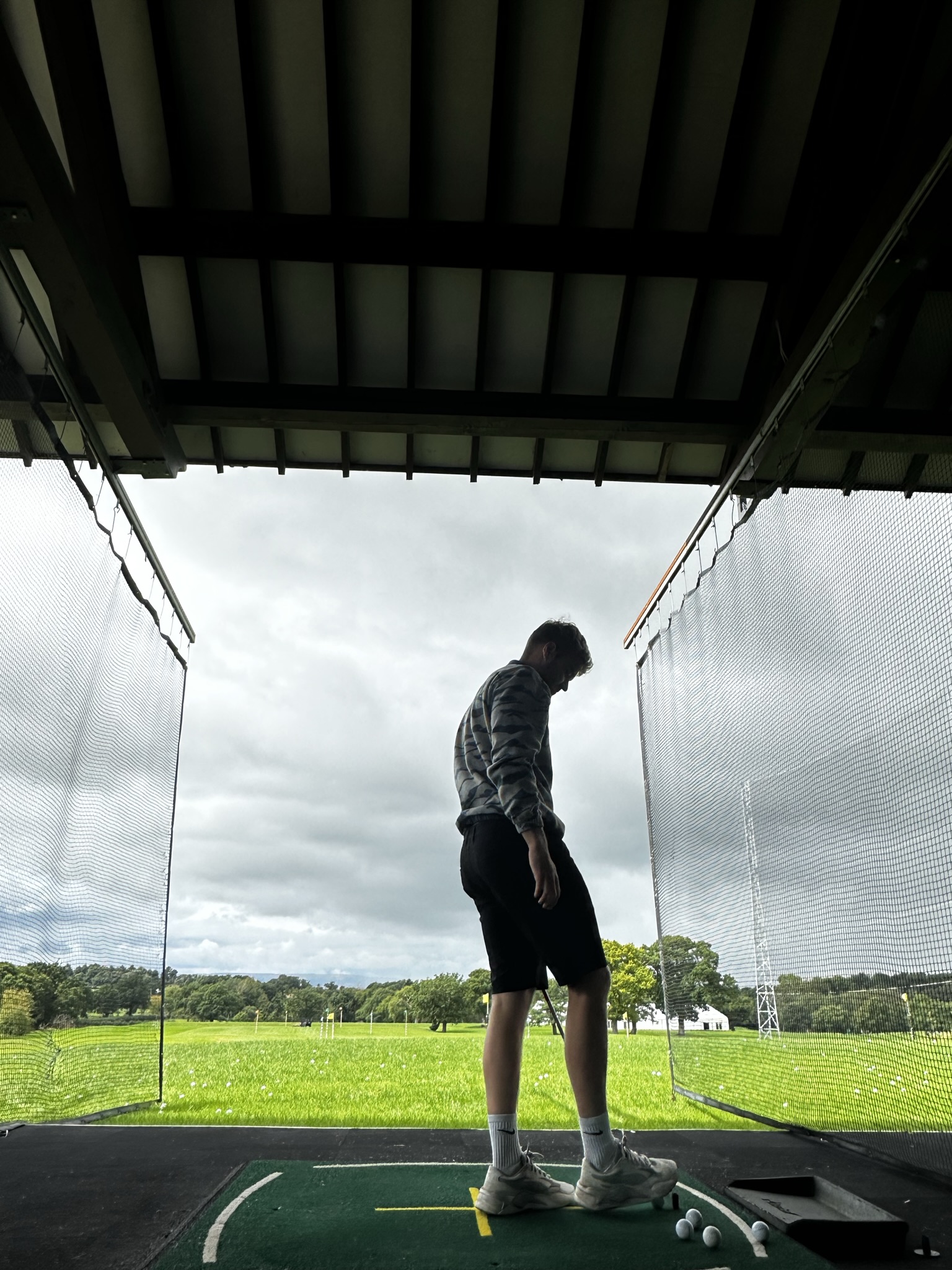 A picture of Brett (my boyfriend) at the golg driving range at Carden Park